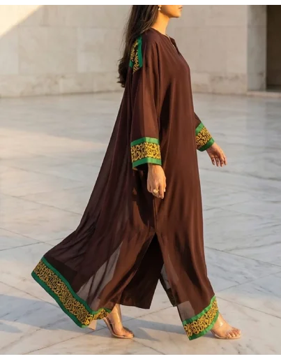 Detailed calligraphy on chocolate brown georgette kaftan.