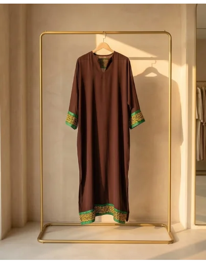 Detailed calligraphy on chocolate brown georgette kaftan.