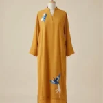 Mustard georgette kaftan with pintucks embroidered birds detailing.