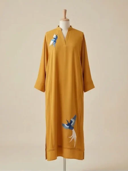 Mustard georgette kaftan with pintucks embroidered birds detailing.