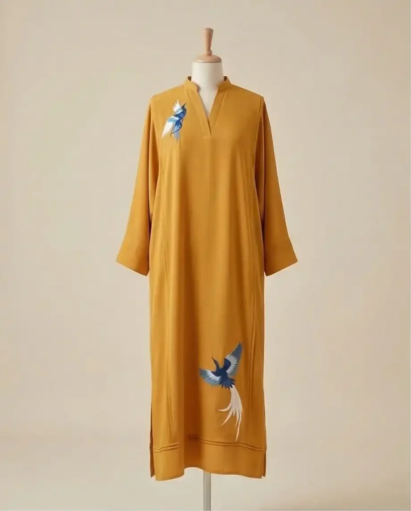 Mustard georgette kaftan with pintucks embroidered birds detailing.